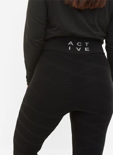 Seamless træningstights med strukturmønster, Black, Model image number 1